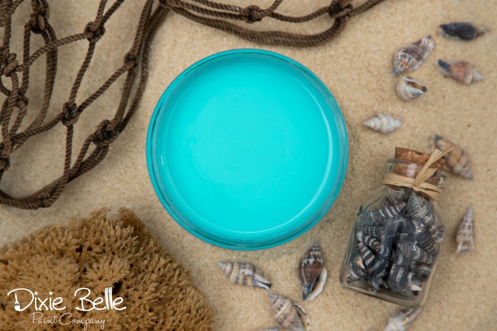 Jar of Dixie Belle chalk mineral paint in the color of Pure ocean blue