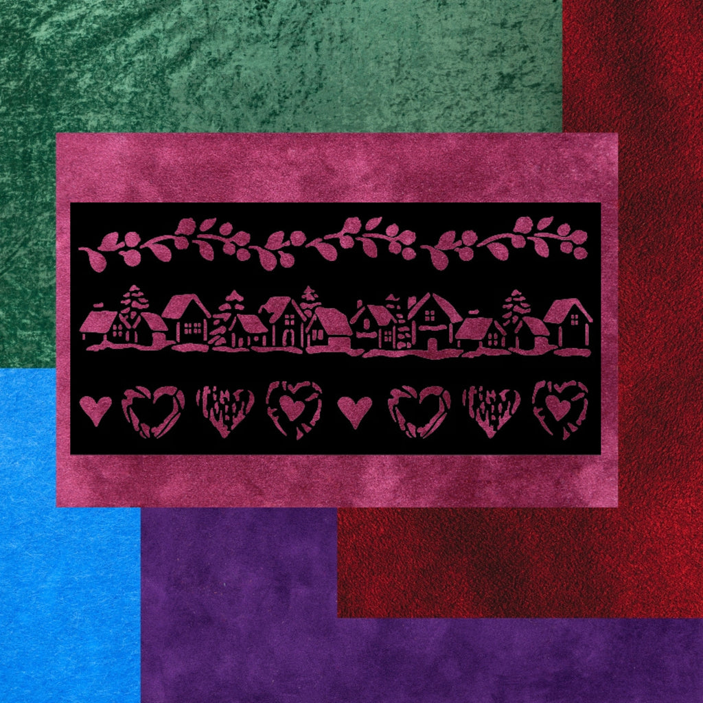 Decorative stencil with house and heart patterns on a colorful textured velvet background