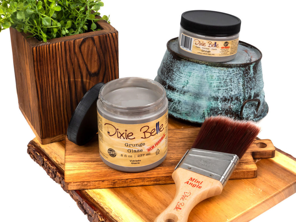 Paintbrush and Jar grouping of Dixie Belle Glaze in the light brown color of Grunge