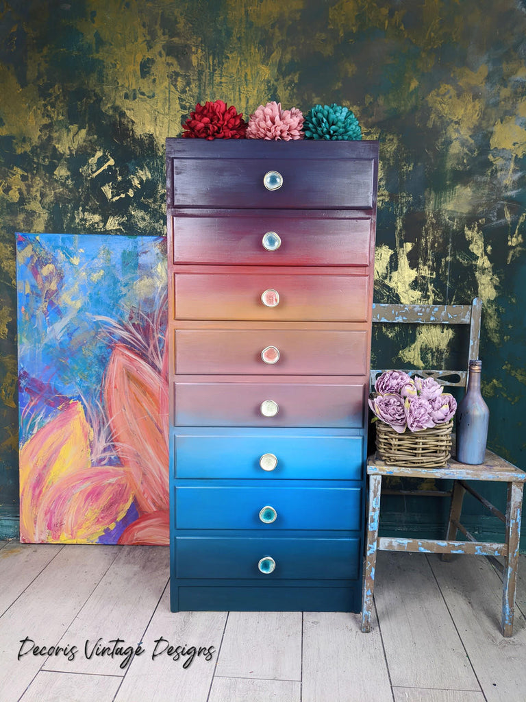 Rainbow colored cabinet coated in Dixie Belle Glaze in the color of  Pearlescent