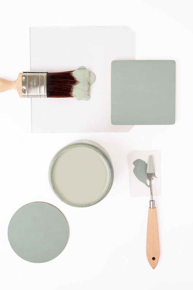 Painting tools and a color swatch on a white background