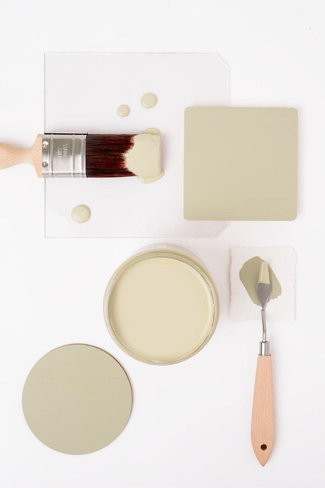 Paint sample with a brush and palette knife on a white background