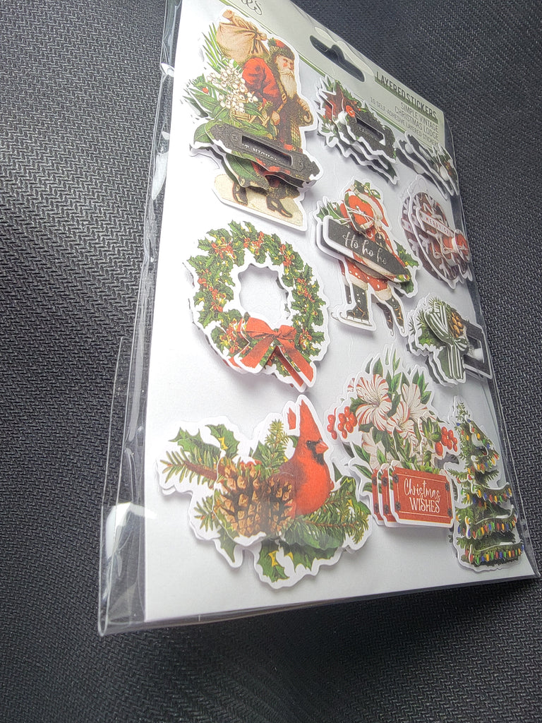 This package contains ten (10) Simple Stories - Simple Vintage Christmas Lodge Chipboard Stickers 5"x7" inch sheet